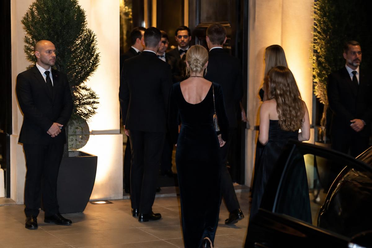Security personnel at the entrance of a black-tie private event